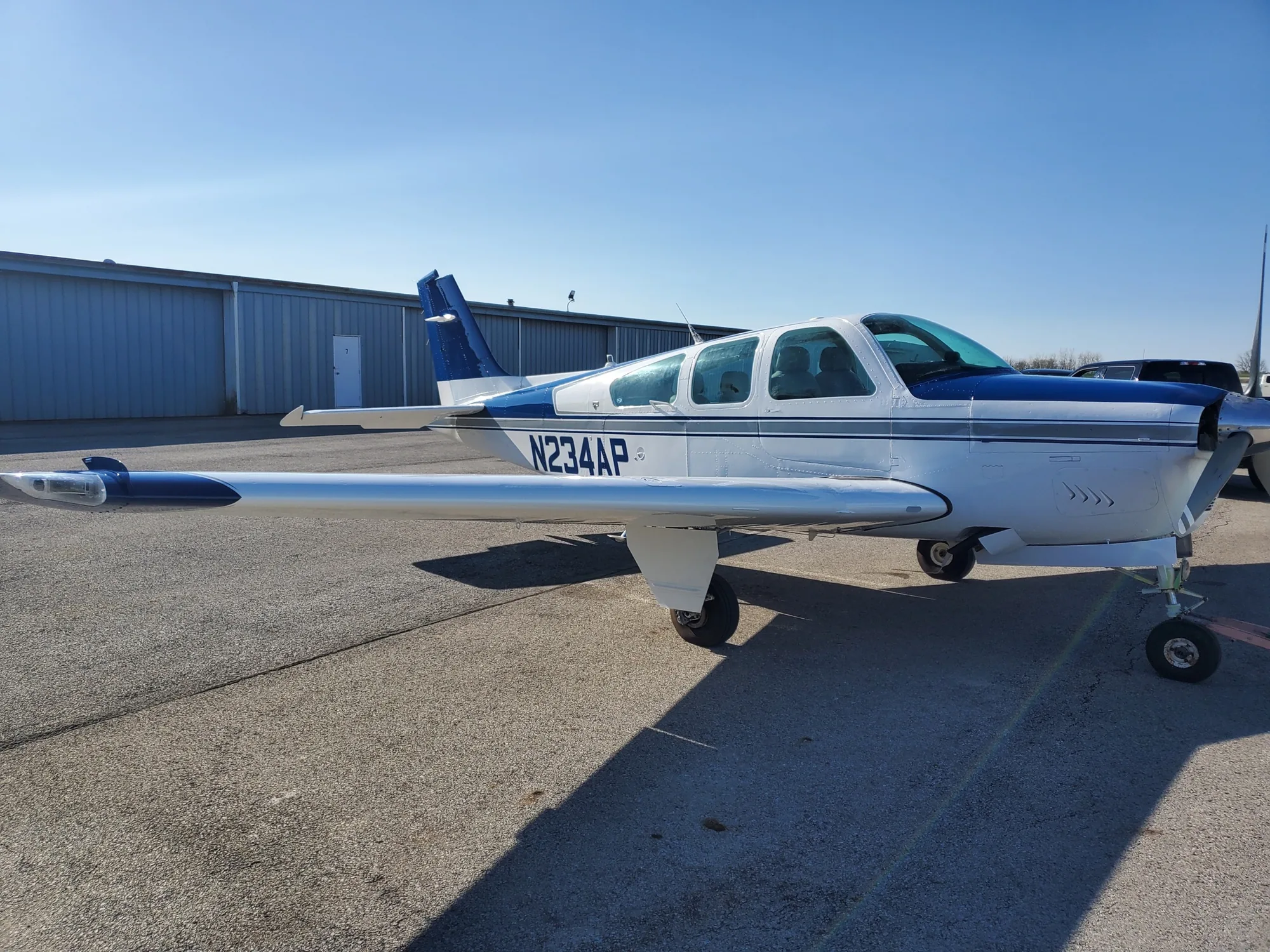 Classic white aircraft with deep blue accent striping