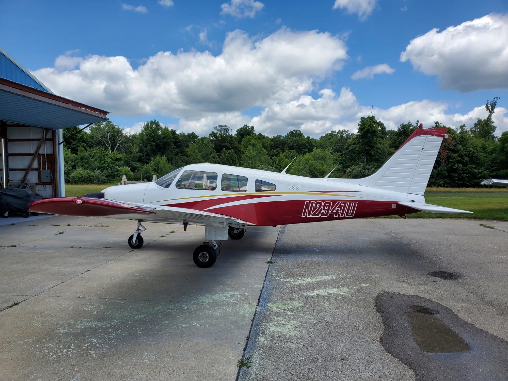 Maroon and white aircraft refinished by Hangar 74