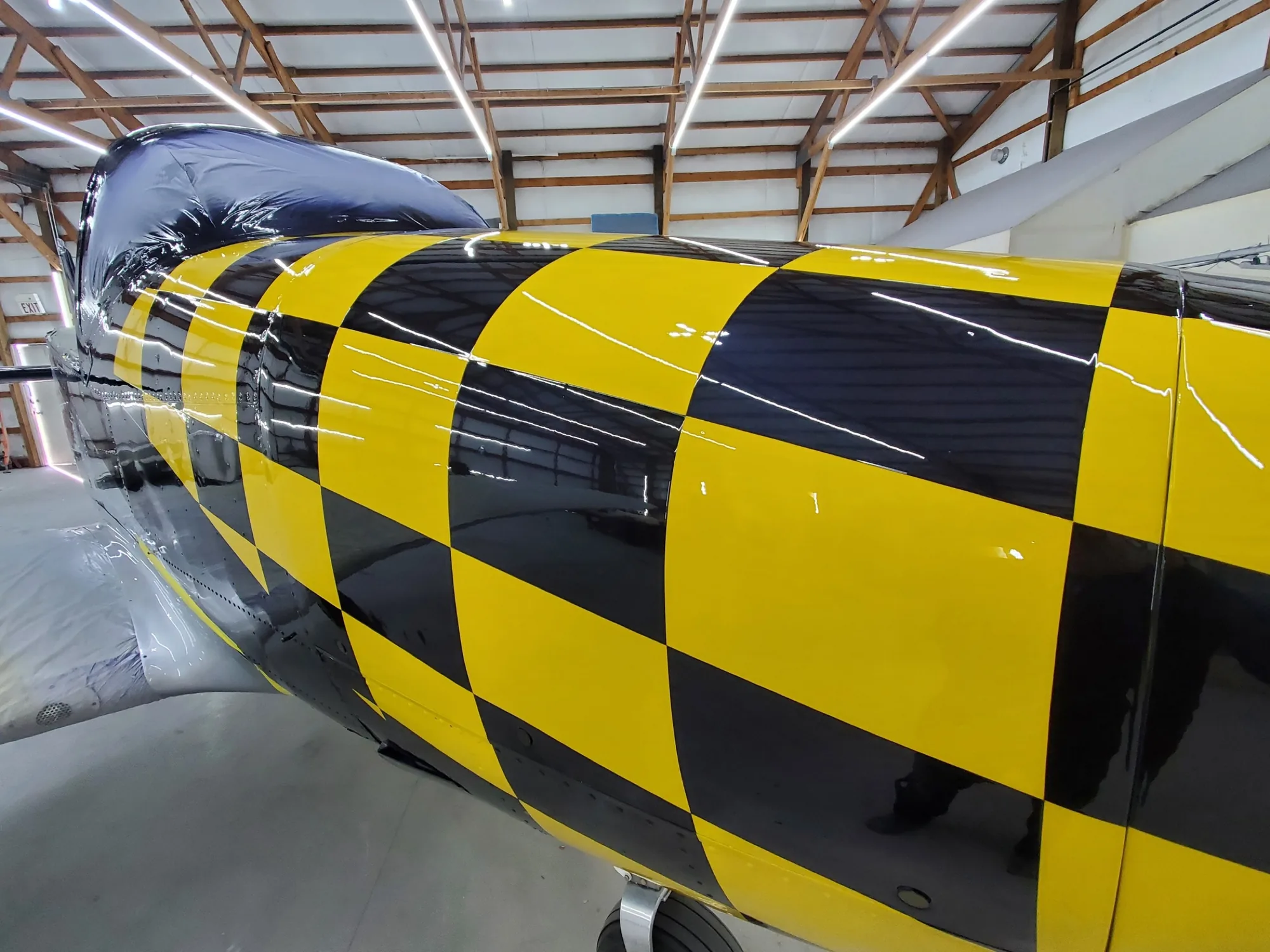 Glossy yellow and black checkerboard paint detail