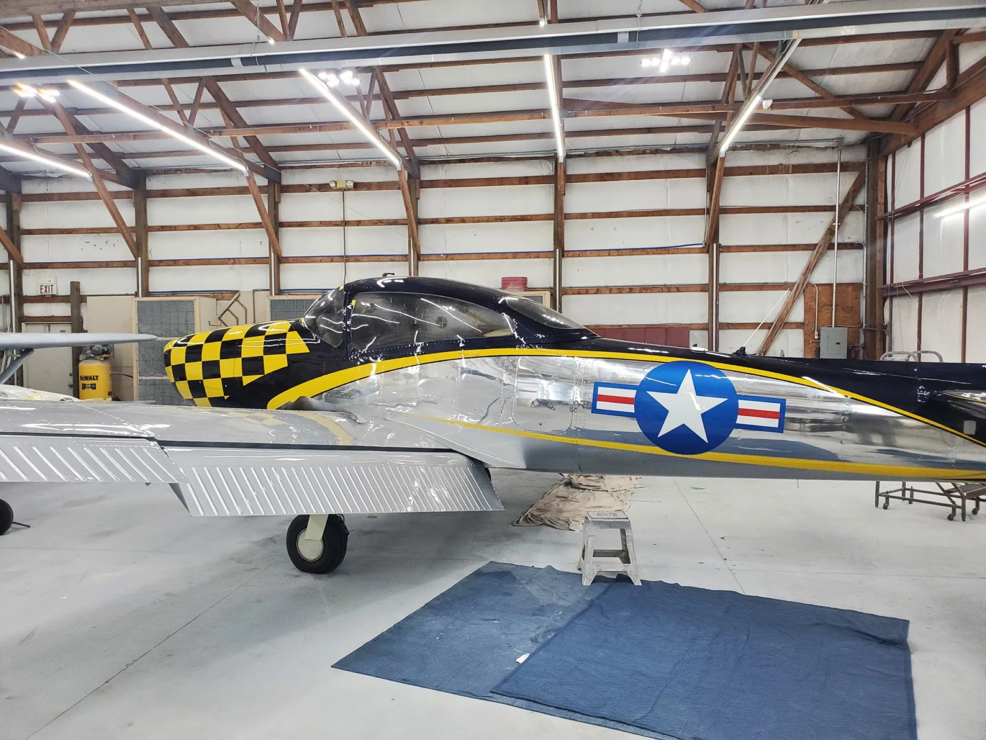 Finished polished aircraft with yellow and black graphics