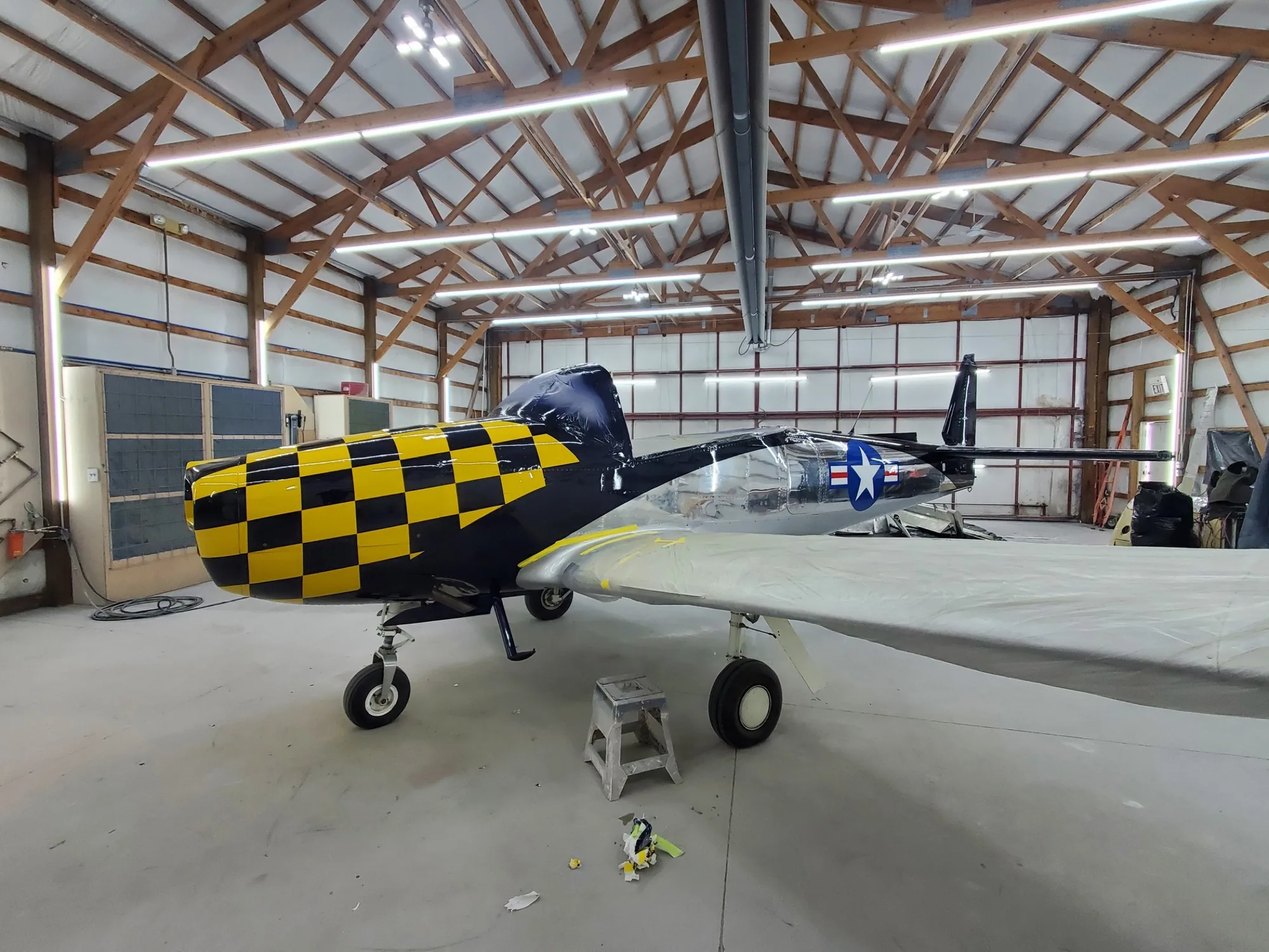 Aircraft paintwork in progress with masked surfaces