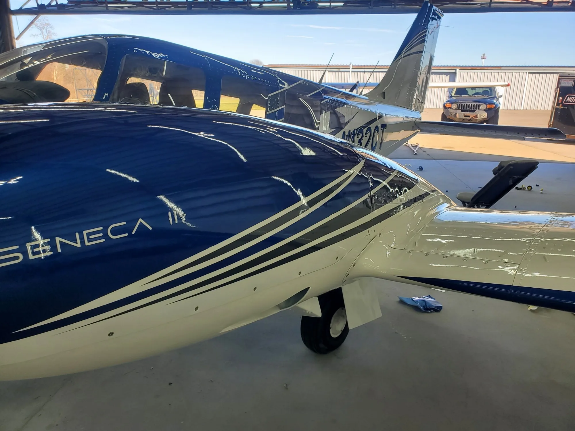 Close view of custom stripes aligned across the contours of an aircraft