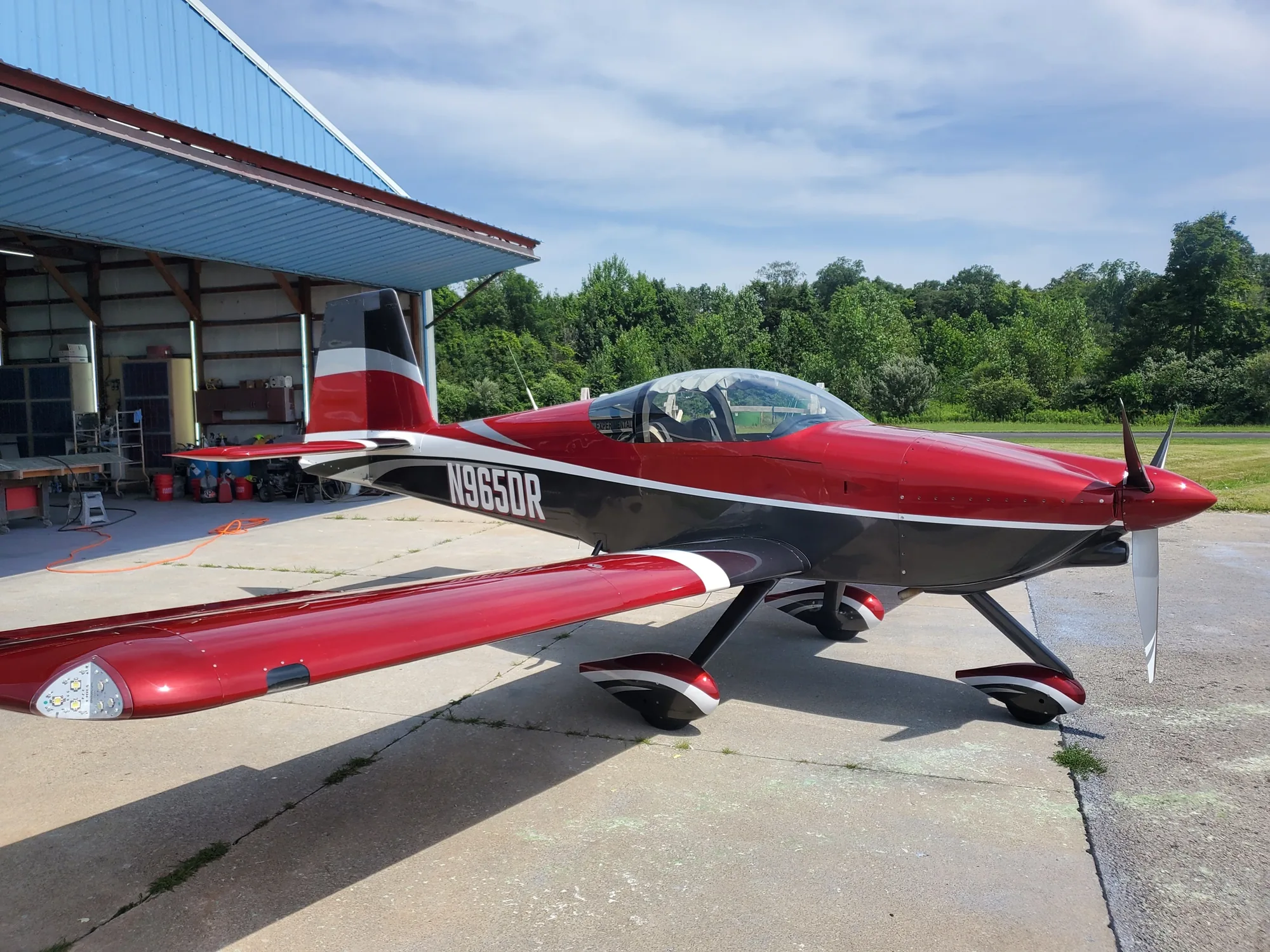 Red and black custom-painted aircraft completed by Hangar 74