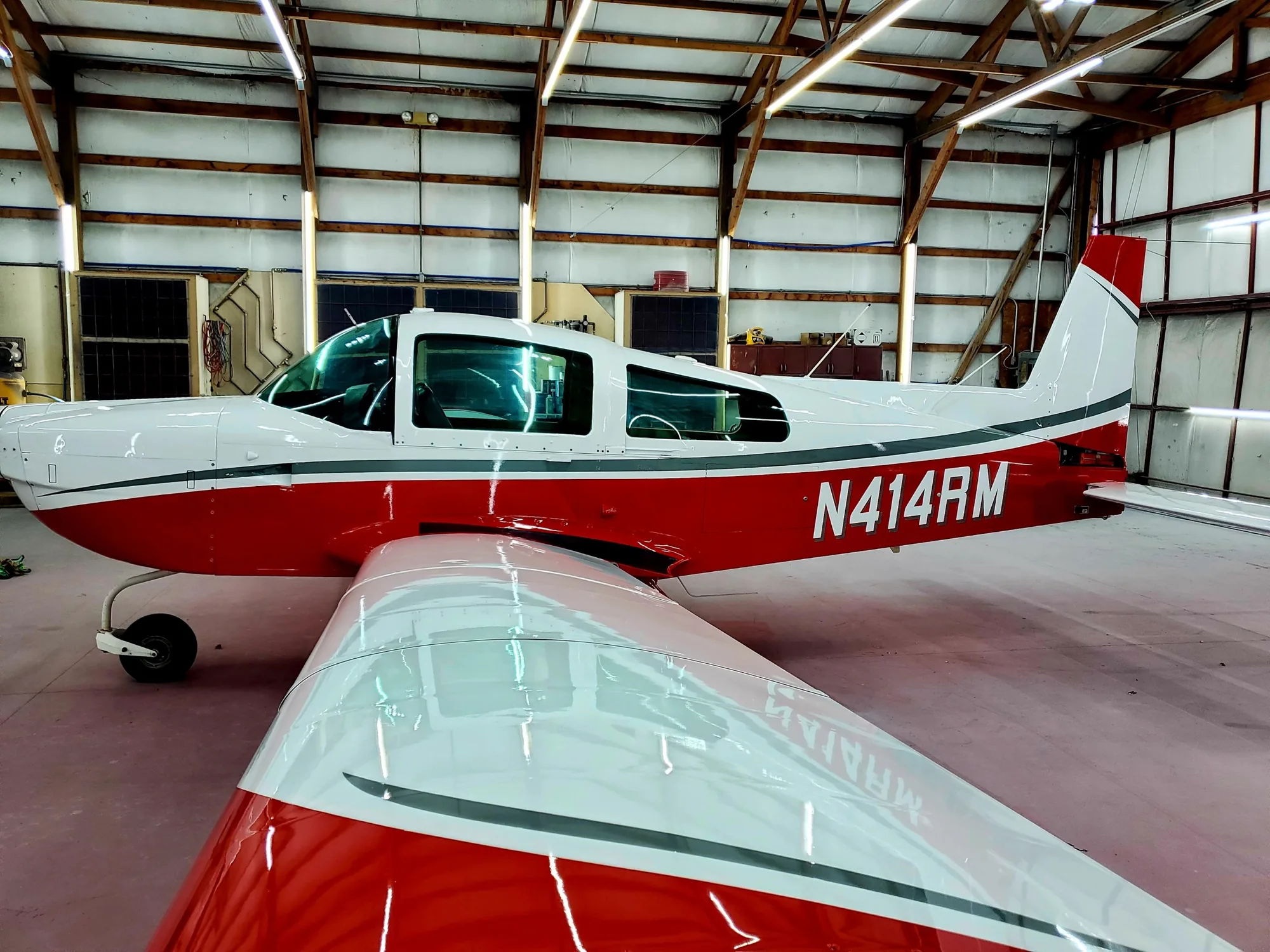 Red and white aircraft with crisp custom striping